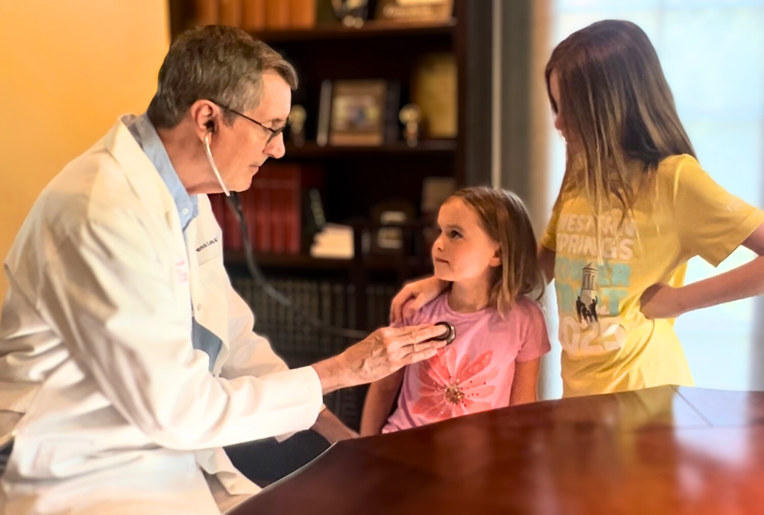 Physician caring for a young patient